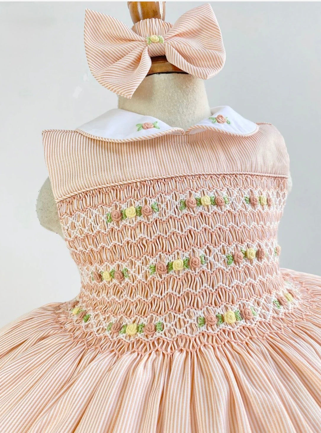 Pale Peach pinstripe hand smocked dress