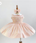 Pale Peach pinstripe hand smocked dress